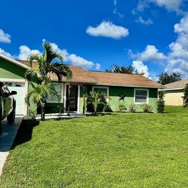 Ranch-style house featuring a 2 car  garage