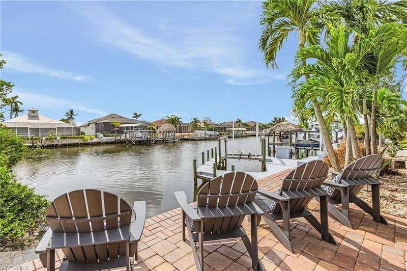 Dock featuring a residential view and a water view