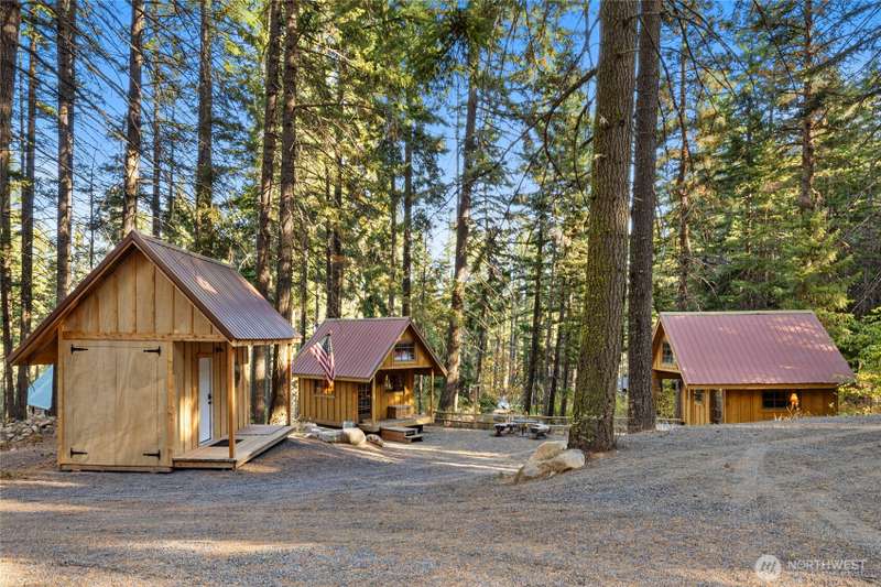 There is just so much to this Sky Meadows lot! The main gathering spot features 2 mini-cabins and the large storage shed.
