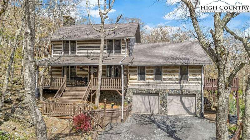 This lovely 3 bedroom, 2 bath antique style log ca