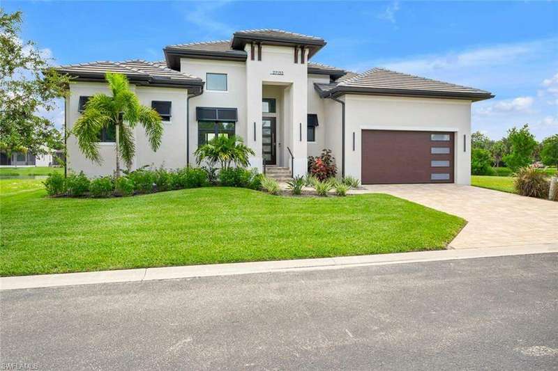 Modern Prairie-style house with designer windows, doors and Bermuda style shutters.