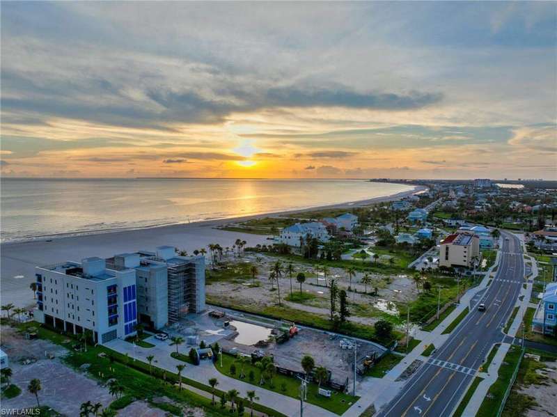 Aerial view at dusk of view of water and beach