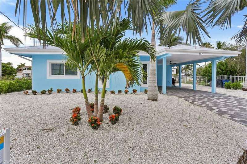 View of front of home with a carport