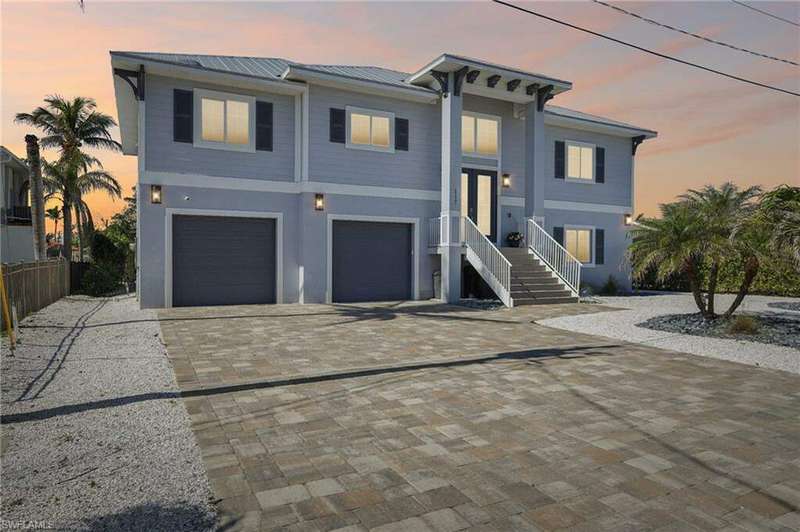View of front of property with a garage