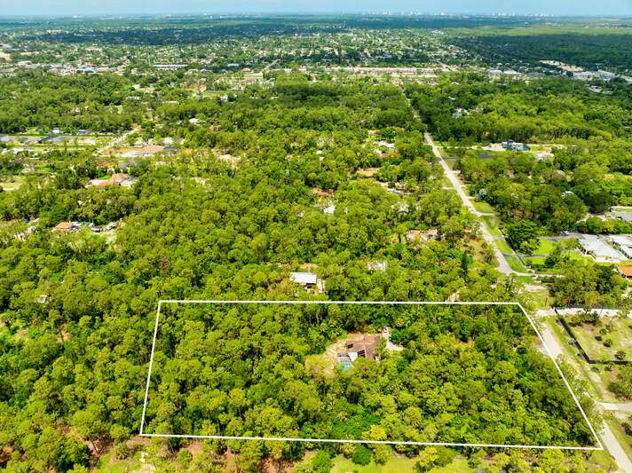 Aerial view of property's location featuring property parcel outlined