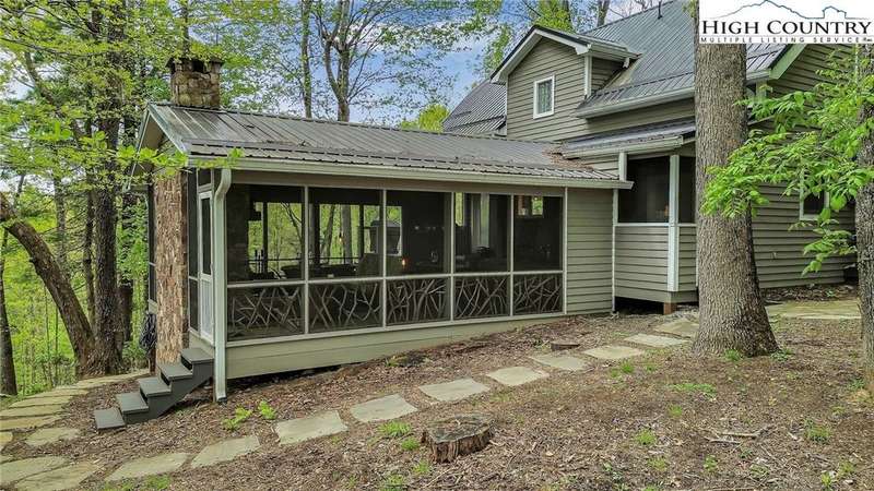 Large screened porch with fireplace.