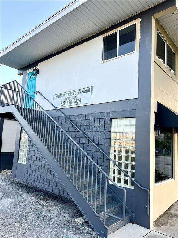 View of building exterior featuring stairs
