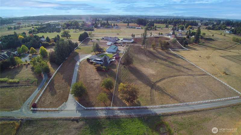 Welcome Home to this 9.78-acre estate in Enumclaw offering unparalleled views of the Cascades & Mount Rainier