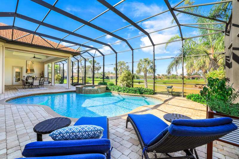 Birds eye view of property with a water view