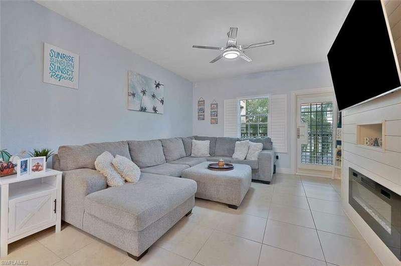 Tiled living room with ceiling fan