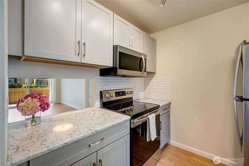 Welcome Home! Newer kitchen featuring Thomasville cabinetry.