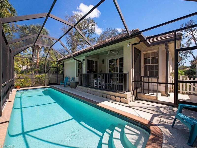 View of pool featuring a lanai, a patio area, and ceiling fan