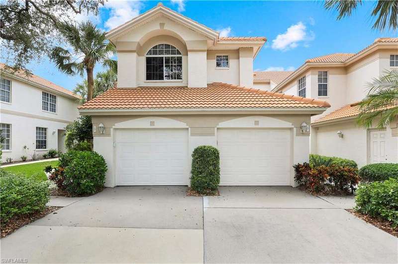 Mediterranean / spanish-style home featuring concrete driveway, a tile roof, stucco siding, and an attached garage