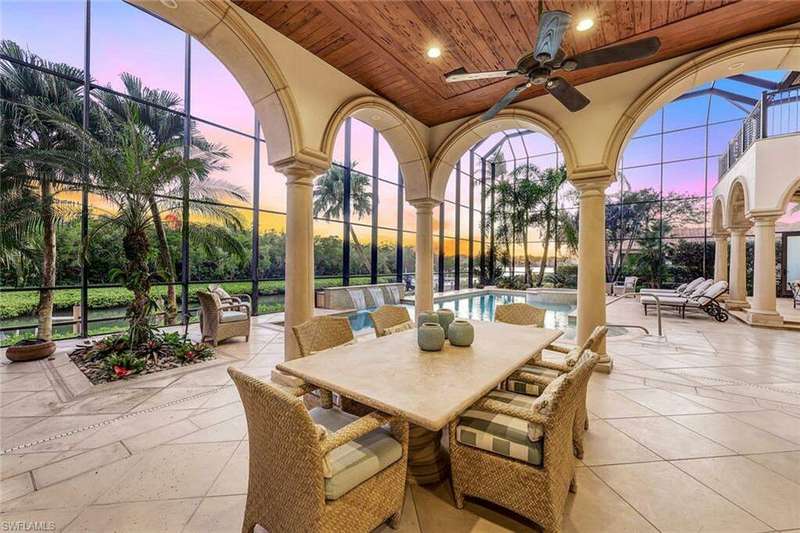Expansive outdoor living areas with views of Naples Bay
