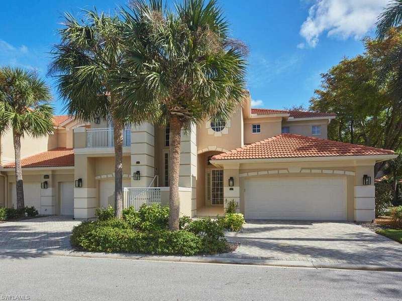 Mediterranean / spanish-style home with a balcony and a garage