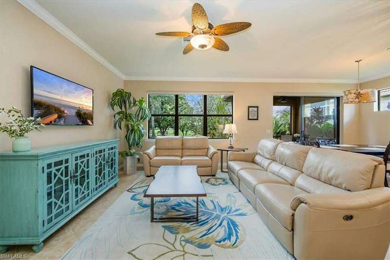 Great room with crown molding, abundant natural lighting - bringing nature indoors!