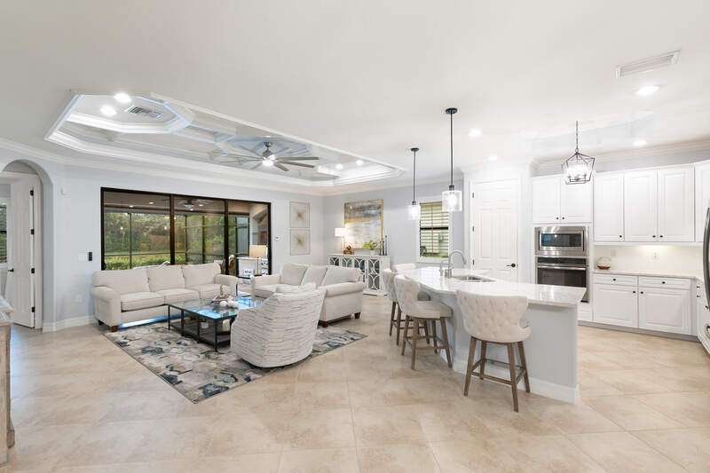 Mediterranean / spanish house featuring stucco siding, a front lawn, decorative driveway, and an attached garage