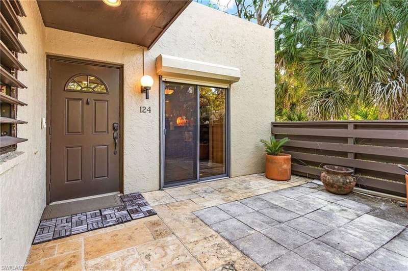 Entrance to property featuring stucco siding