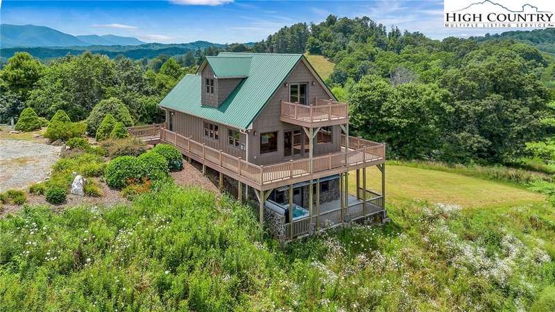 The covered back deck, upstairs bedroom deck, and