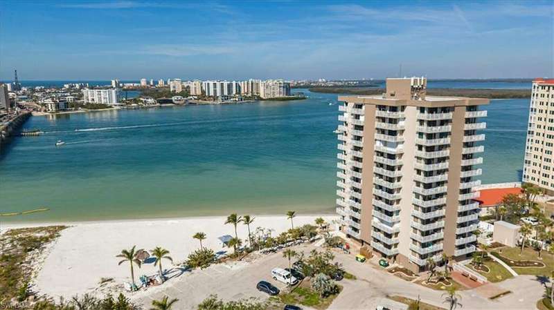 Property view of water featuring a beach view