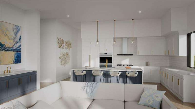 Kitchen featuring pendant lighting, light wood-type flooring, a kitchen island, and wall chimney range hood