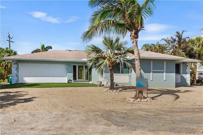 Single story home with a garage