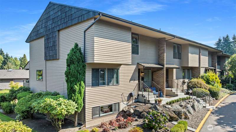 Spacious townhome lives like a house with its three-stories, separate entrance, nearly 2300 square feet and two-car garage wired for car charging!
