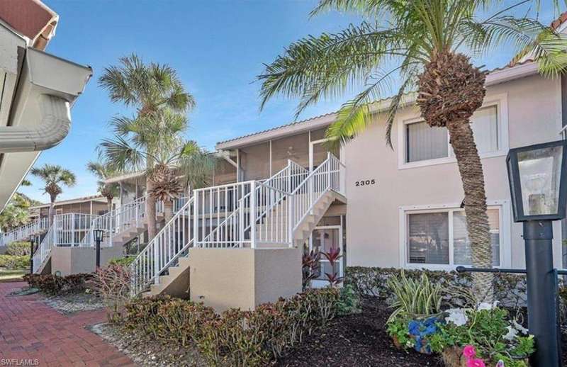 View of building exterior featuring stairs