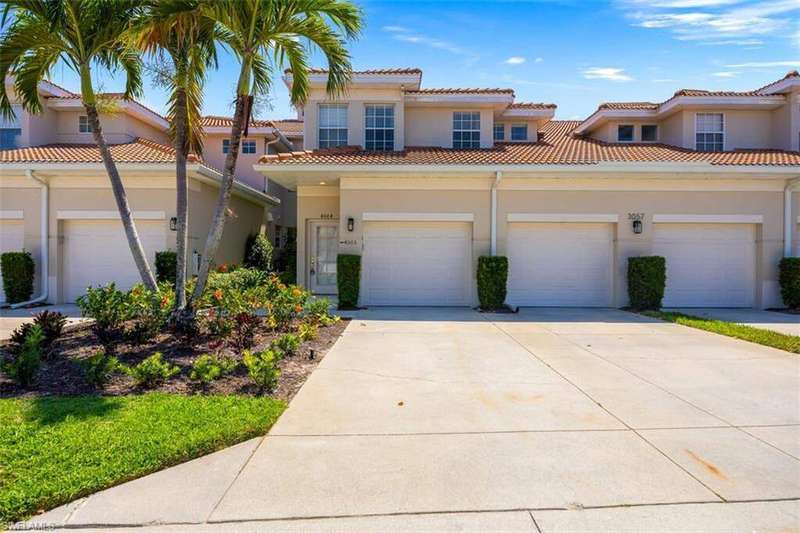 Mediterranean / spanish house featuring concrete driveway, stucco siding, an attached garage, and a tiled roof