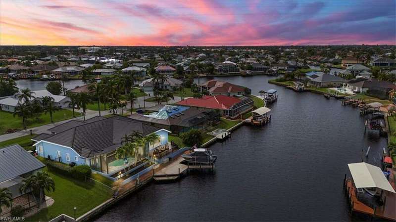 Gulf access canal with view of home