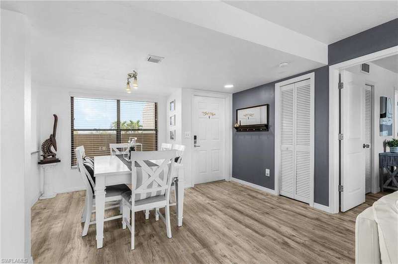 Dining space with baseboards, light wood-style flooring, and visible vents
