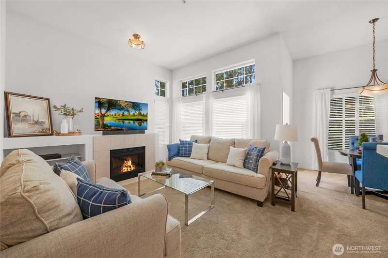 Light and bright top floor condo with soaring vaulted ceilings