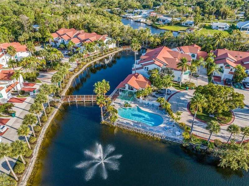 Aerial view of a nearby body of water and a pool