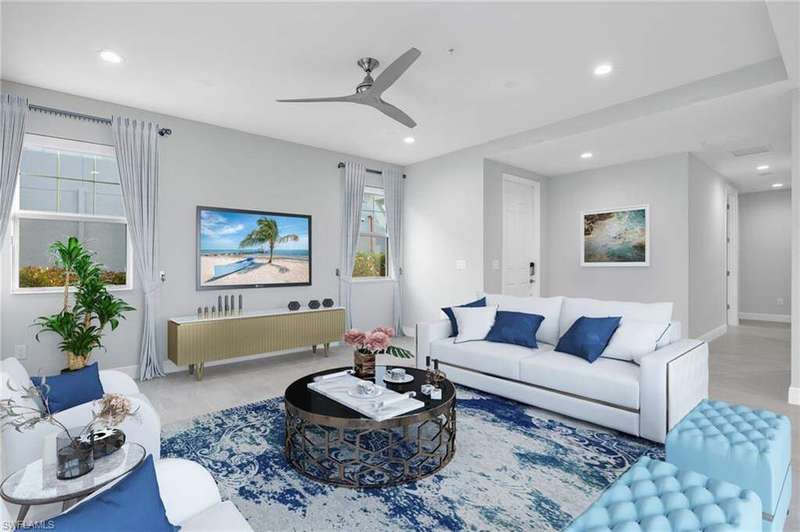 Living room featuring ceiling fan