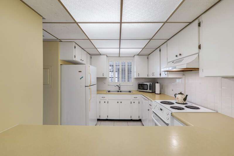 Master bedroom offers a cozy view overlooking the Oyster Bay canal and the property's private docks