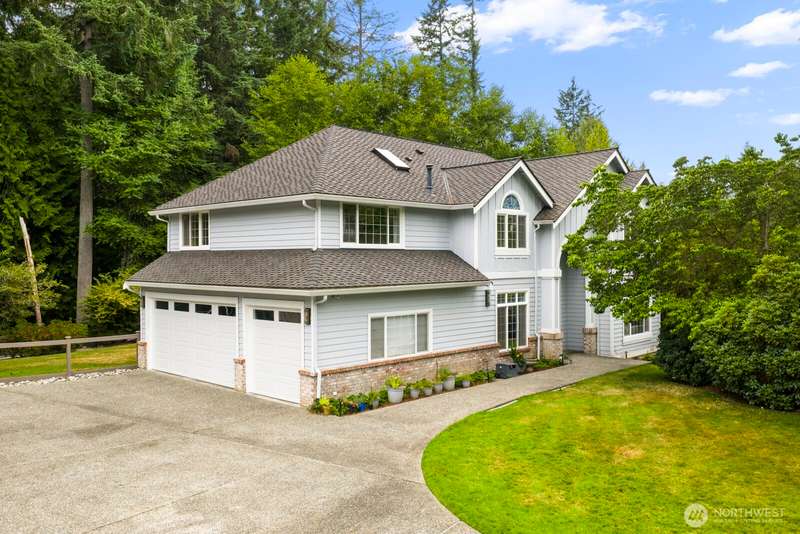 Welcome to this beautifully updated 4-bedroom, 2.5-bathroom contemporary home, nestled in the highly sought-after Lake of the Woods neighborhood in Woodinville.