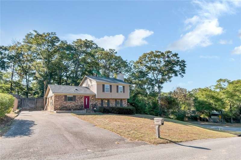 Split level home featuring a front yard