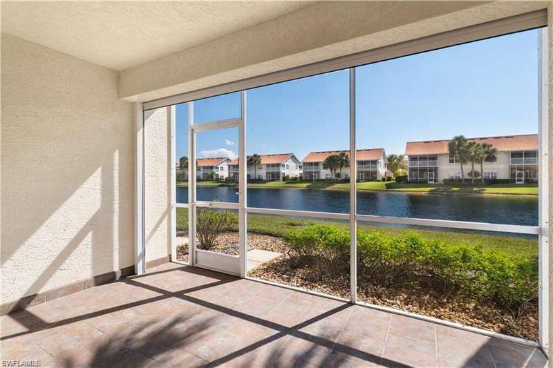 Unfurnished sunroom with a water view