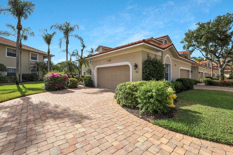 Sunny lanai with view of lake and fountain
