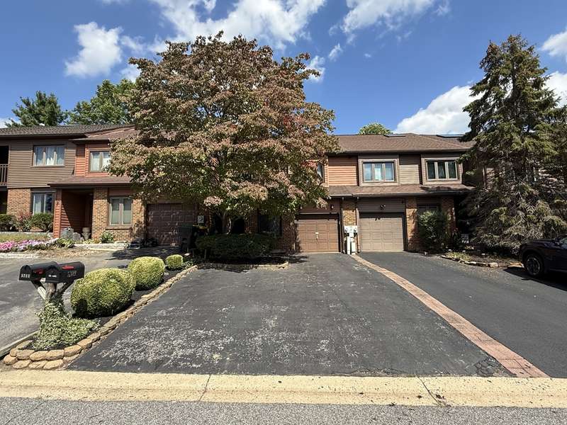 Front exterior-extended driveway for ample parking