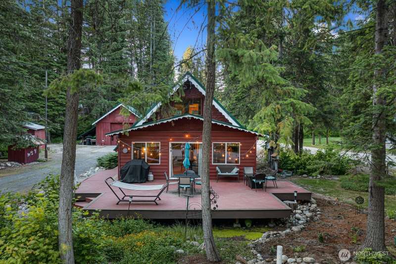 Stunningly Landscaped Front Yard with Expansive Deck    Enjoy outdoor living at its finest with a beautifully landscaped front yard and an entertainment-sized deckperfect for gatherings, relaxation, or simply taking in the view.