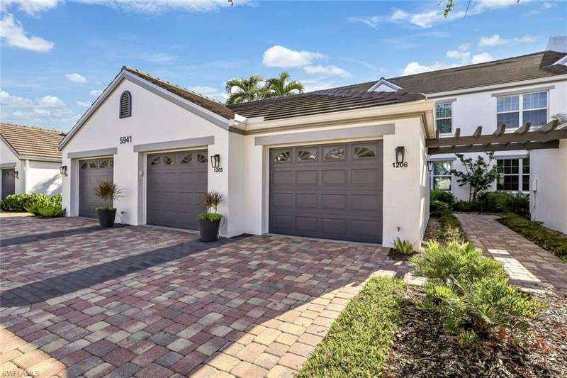 View of front facade featuring a garage