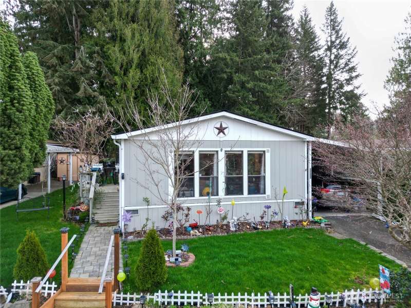 Welcome to this manufactured home in a 55+ community