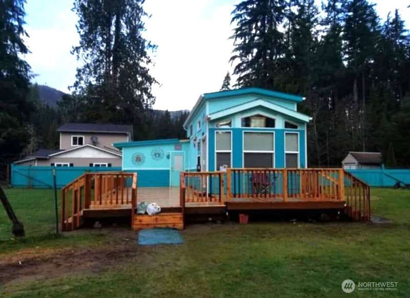 tiny home is original park model with added room and deck