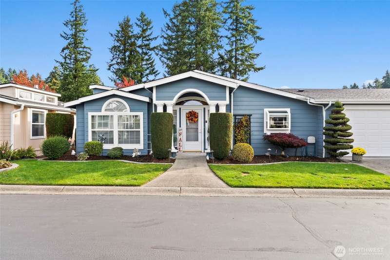 Beautifully maintained home with inviting curb appeal and manicured landscaping.
