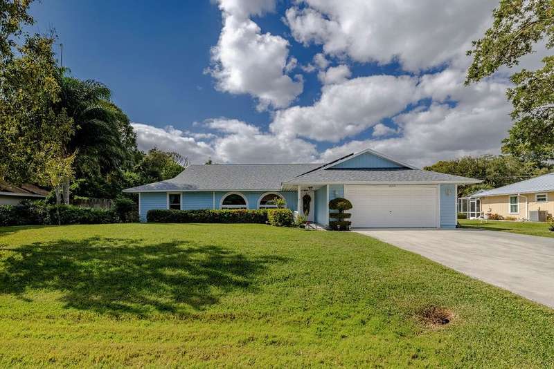 Single story home with a front yard, concrete driv