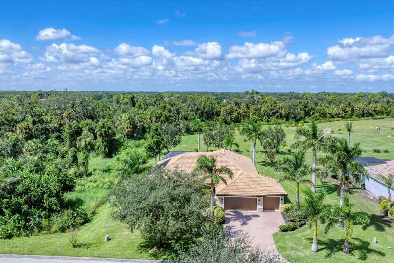 Aerial of home, preserve to the left