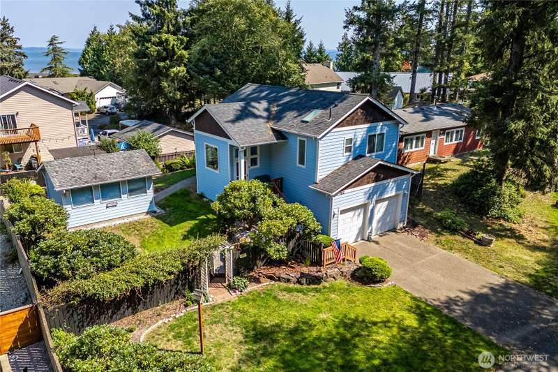 Bay views are waiting for you at this adorable split-level home!