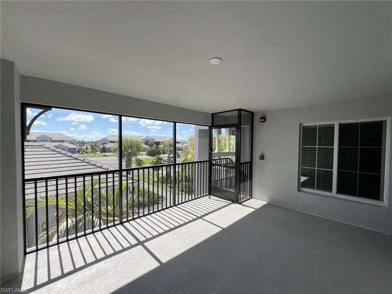 Prairie-style home featuring decorative driveway and a tiled roof