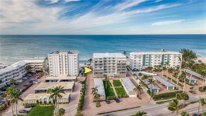 Aerial view of expansive beach and apartment complex